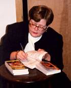 Tammy signing books in Concord, MA, Author Tour 2001